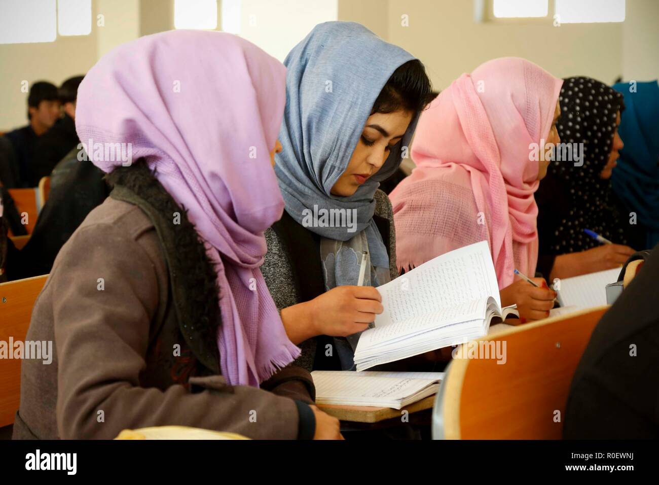 Bamiyan, Afghanistan. 4th Nov, 2018. University students attend a class at Bamiyan University in Bamiyan province, central Afghanistan, Nov. 4, 2018. Established around two decades ago, but shut down by the Taliban outfit in 1997, after the armed outfit overran Bamiyan province, Bamiyan University was reopened in 2003 and since then has been serving as the main higher educational center in the highland region of Afghanistan. TO GO WITH Feature: More girls enroll in university in Afghanistan's Bamiyan province, post-grad job situation remains tight Credit: Noor Azizi/Xinhua/Alamy Live News Stock Photo