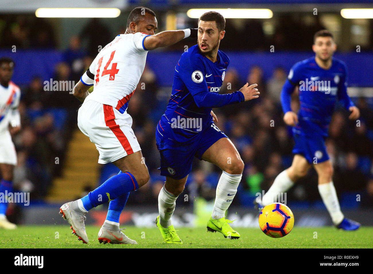 London, UK. 4th Nov 2018. Eden Hazard of Chelsea (c) in action with Jordan Ayew of Crystal Palace (L). Premier League match, Chelsea v Crystal Palace at Stamford Bridge in London on Sunday 4th November 2018.  this image may only be used for Editorial purposes. Editorial use only, license required for commercial use. No use in betting, games or a single club/league/player publications. pic by Steffan Bowen/ Andrew Orchard sports photography/Alamy Live news Stock Photo
