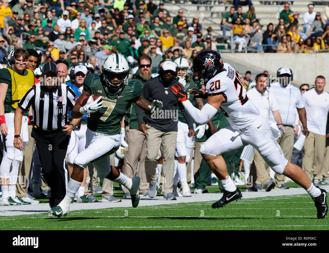 November 3 2018:Oklahoma State Cowboys safety Malcolm Rodriguez (20) tires to tackle Baylor Bears running back John Lovett (7) during the 1st half of the NCAA Football game between the Oklahoma State Cowboys and the Baylor Bears at McLane Stadium in Waco, Texas. Matthew Lynch/CSM Stock Photo