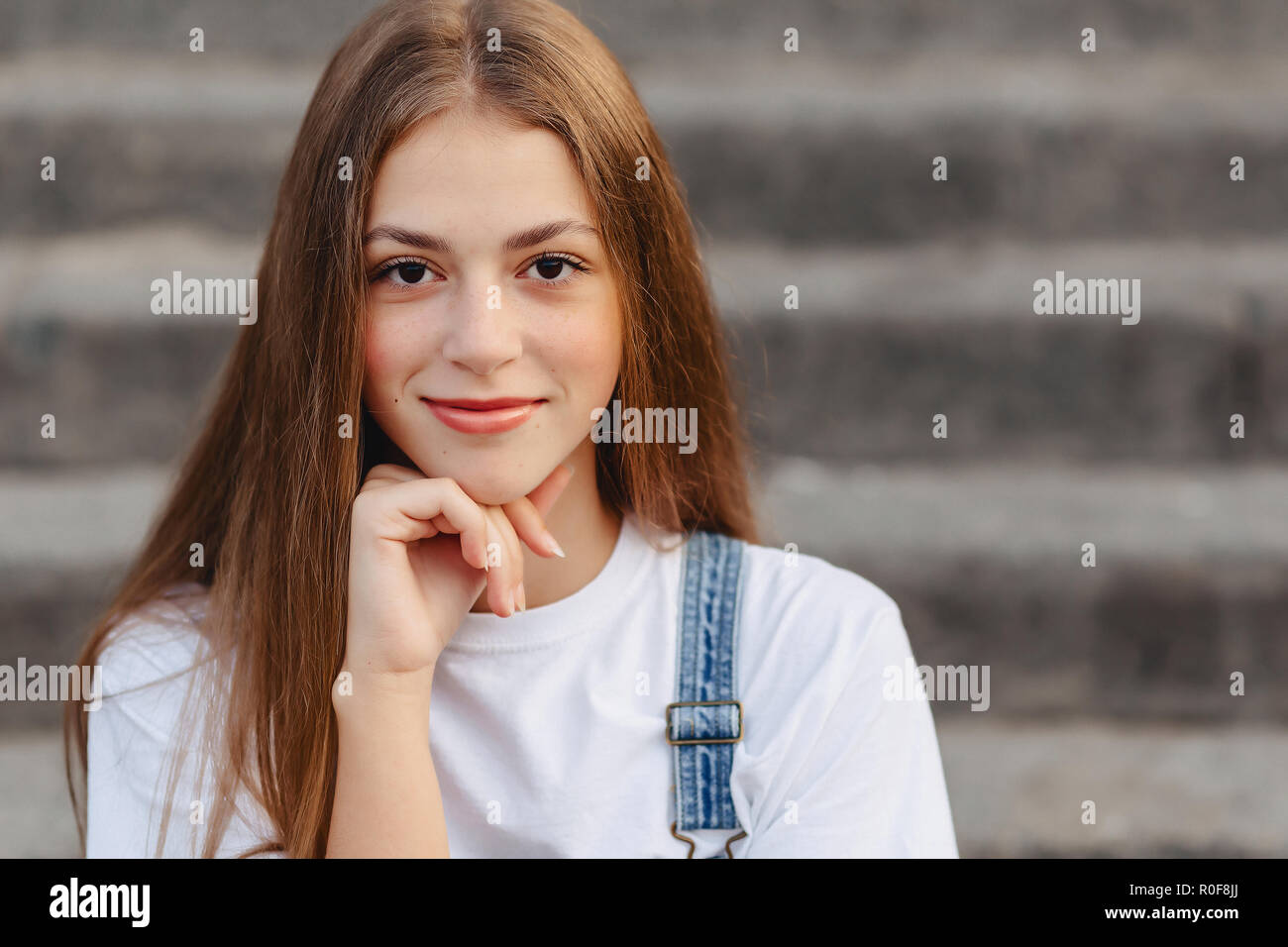 Girl sitting on stairs hi-res stock photography and images - Alamy