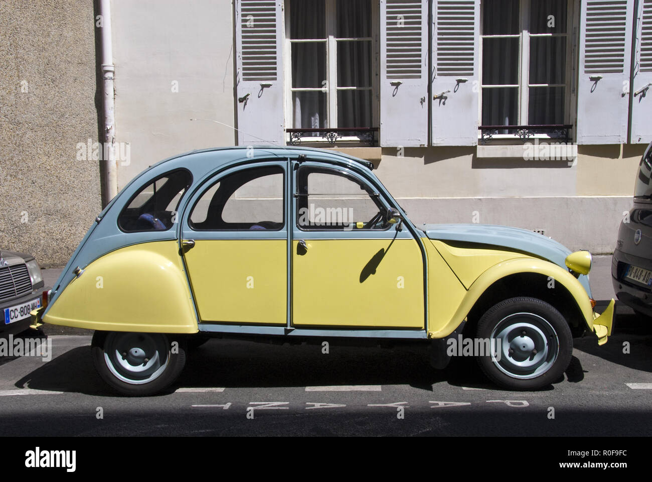 A Citroen 2CV economy car, often nicknamed the 'duck,' parked in the Montparnasse area of Paris, France. Stock Photo