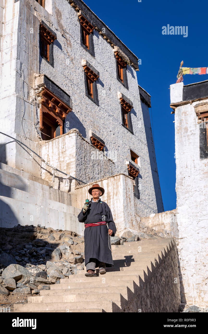 Elderly man with a prayer wheel at Spituk Gompa, Leh district, Ladakh, India Stock Photo