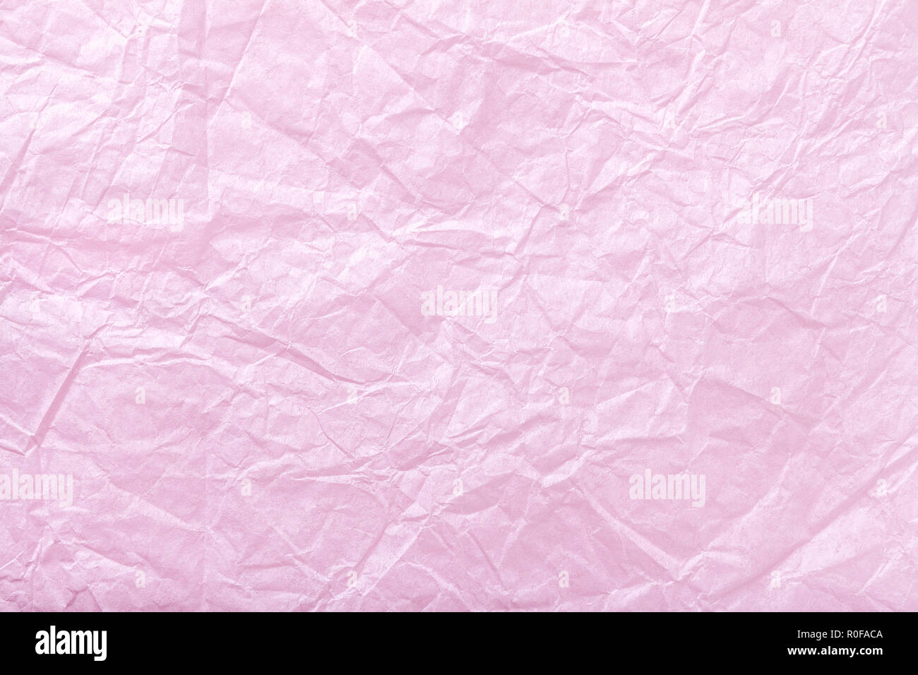 Texture of crumpled pink wrapping paper, closrup. Purple old background Stock Photo