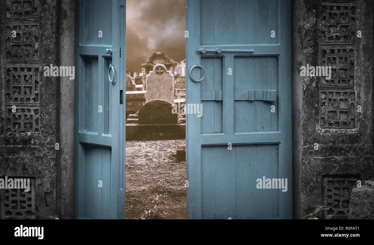 door leading to spooky night graveyard Stock Photo