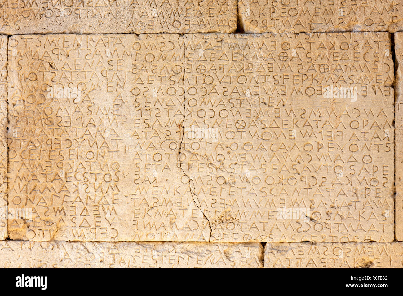 Fragmentary boustrophedon inscription (code of law) in the Agora of Gortyn, Gortyn Bronze Age archaeological site, Agioi Deka, Irakleio Region, Crete  Stock Photo