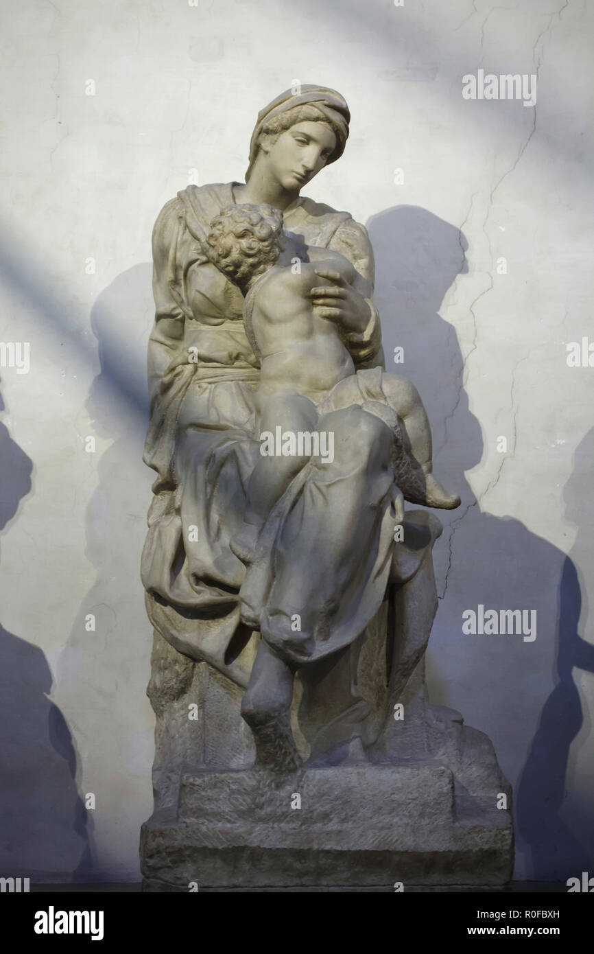 Marble statue of Madonna and Child by Italian Renaissance sculptor Michelangelo Buonarroti (1521) placed on the tomb of Lorenzo the Magnificent and his brother Giuliano de' Medici in the New Sacristy (Sagrestia Nuova) in the Medici Chapels (Cappelle Medicee) in Florence, Tuscany, Italy. Stock Photo