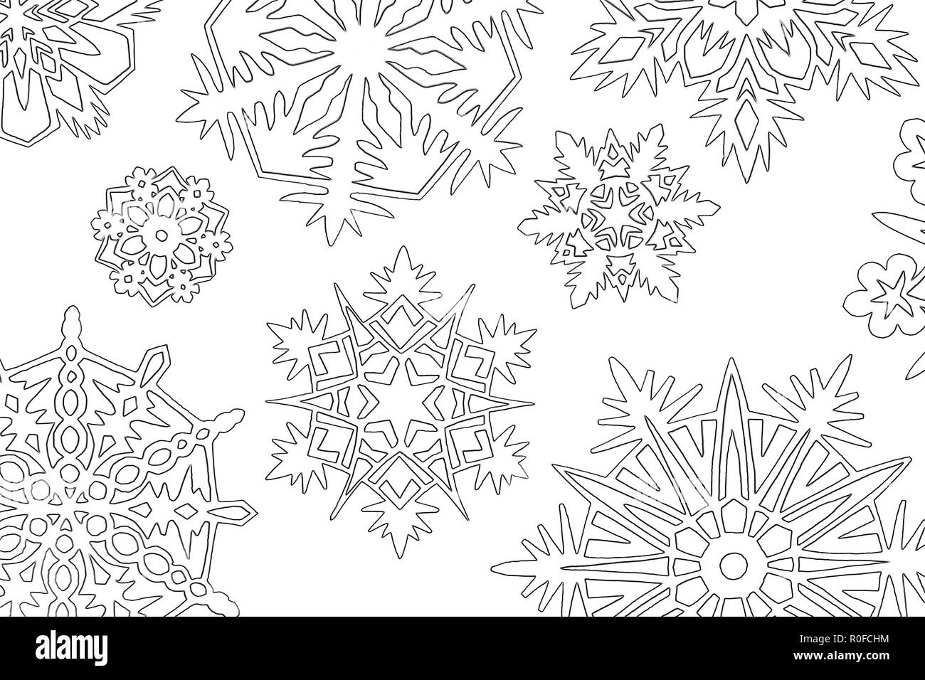 a lot of paper white cutout snowflakes on background Stock Photo - Alamy