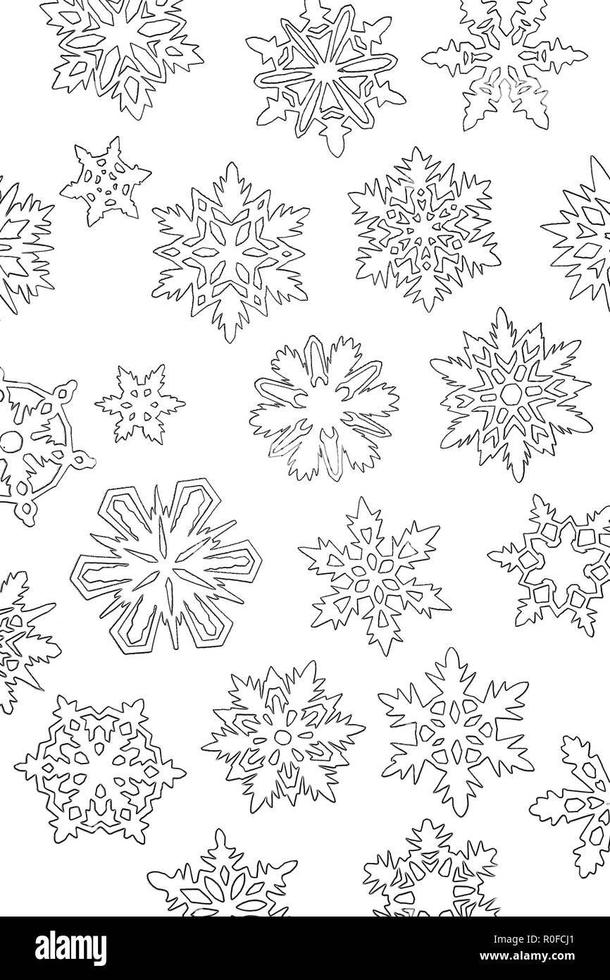 a lot of paper white cutout snowflakes on background Stock Photo - Alamy