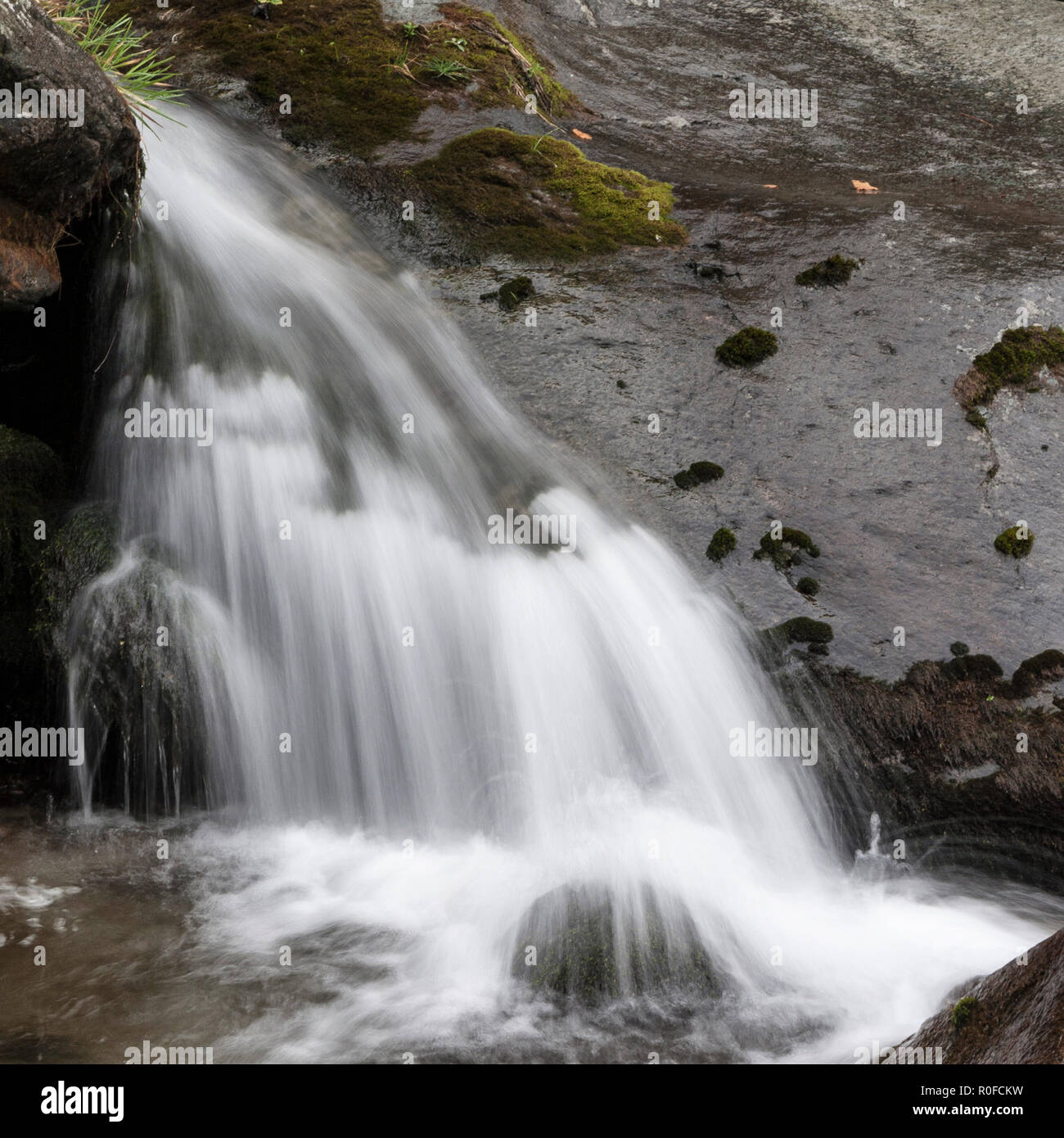 Small waterfall photographed with long exposure Stock Photo