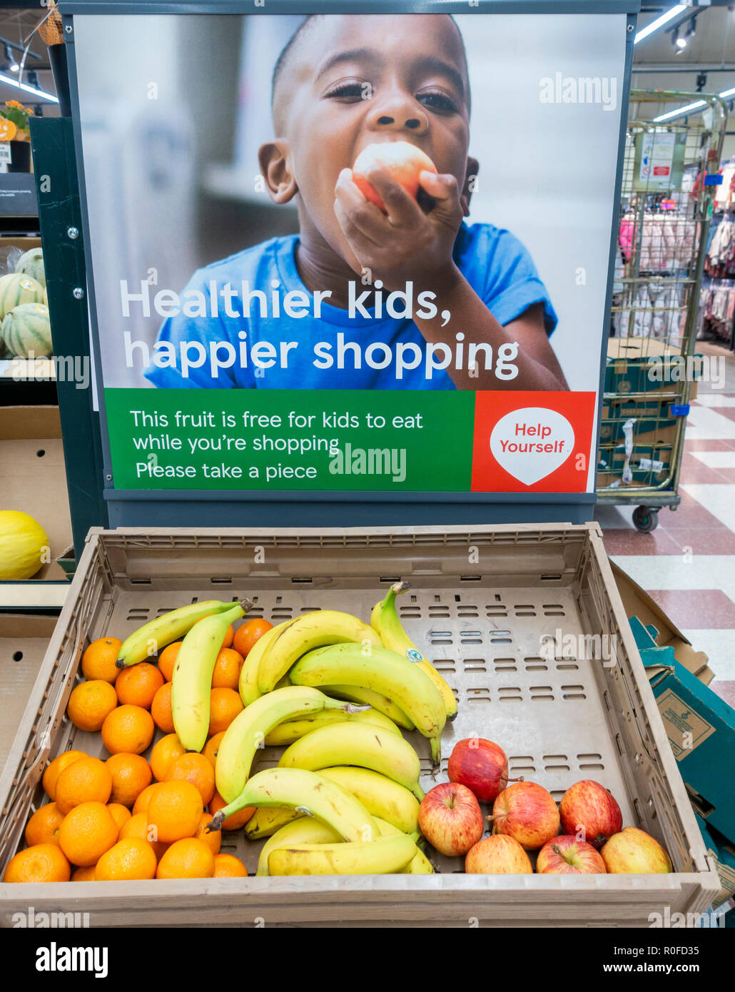 Free fruit for children in Tesco supermarket. UK Stock Photo