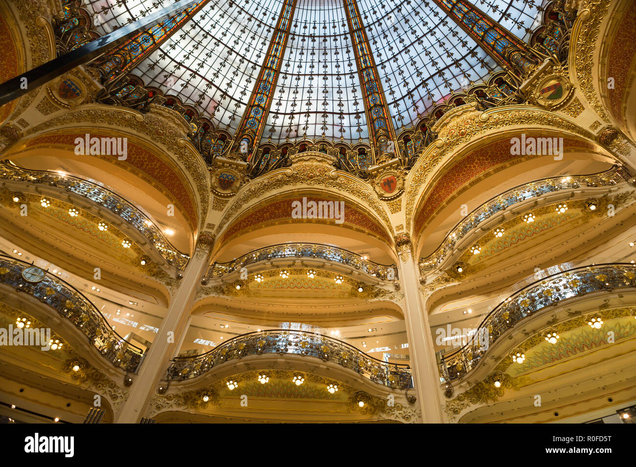 Galeries Lafayette interior in Paris. The architect Georges Chedanne  designed the store where a Art Nouveau glass and steel dome Stock Photo -  Alamy