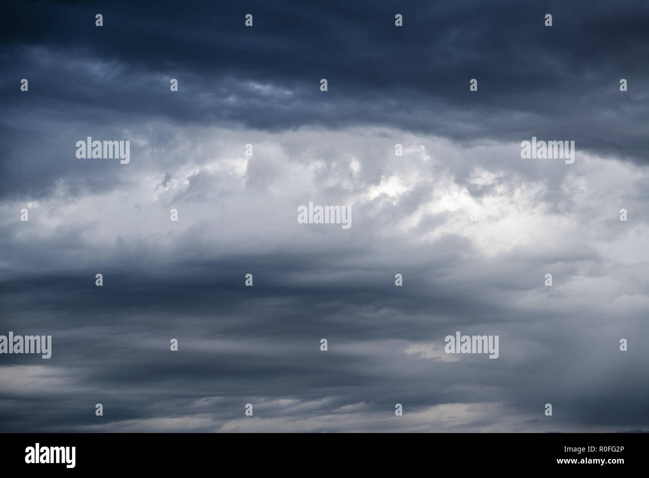 Dark gray dramatic sky with large clouds. Stock Photo