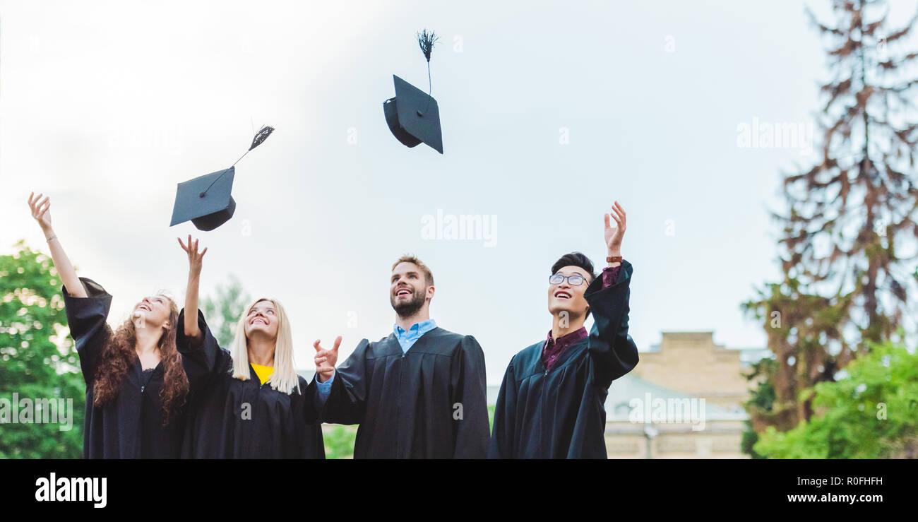 Graduates throwing caps hires stock photography and images Alamy