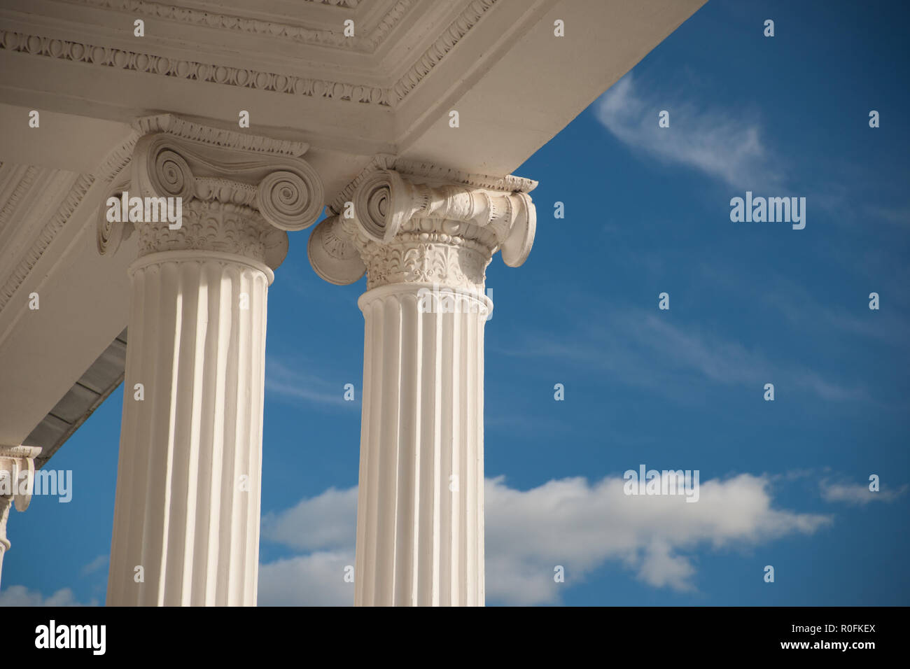 Columns on blue sky background Stock Photo - Alamy