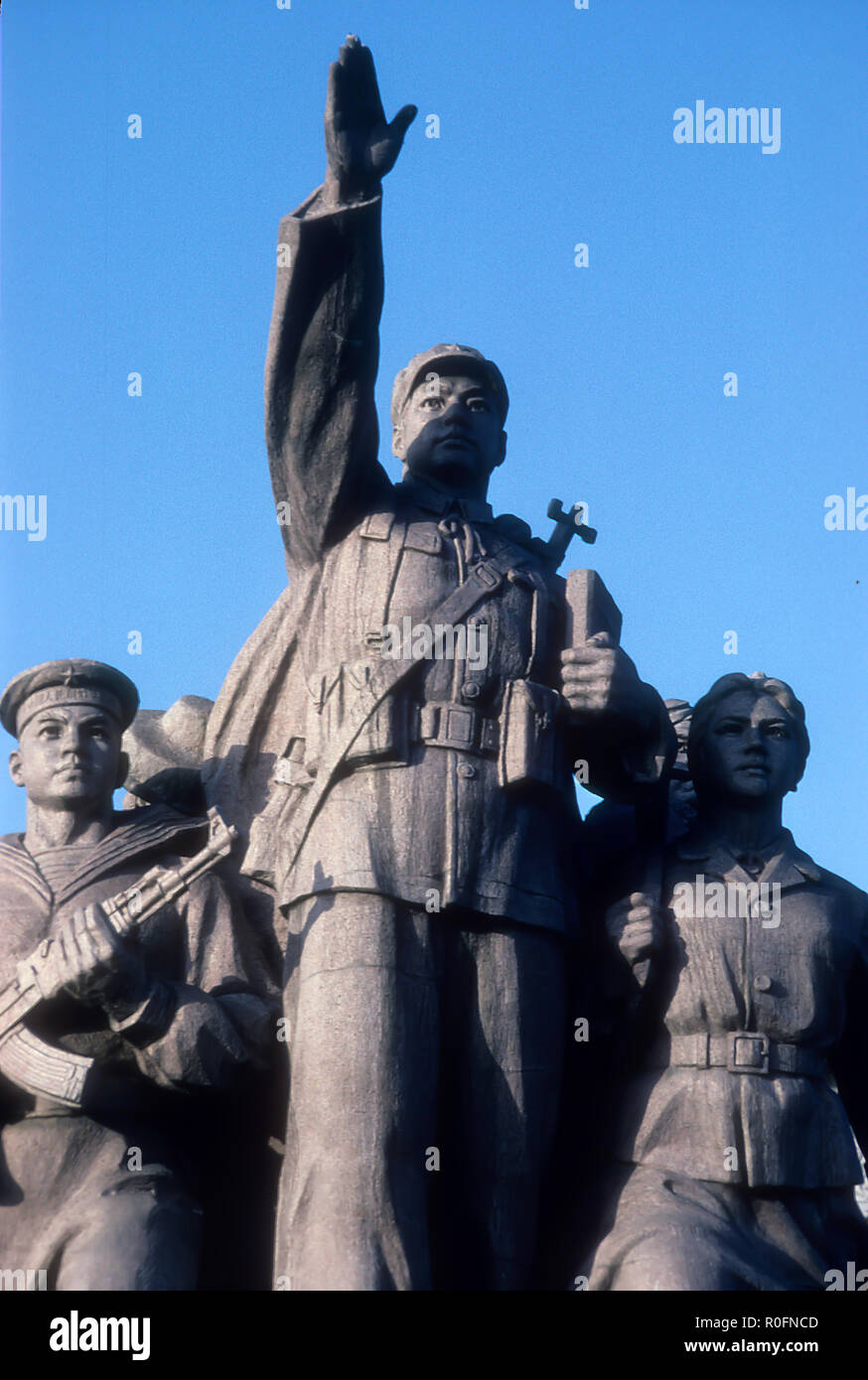 A statue depicting Chairman Mao as the heroic leader of the Chinese Revolution leading his people Stock Photo