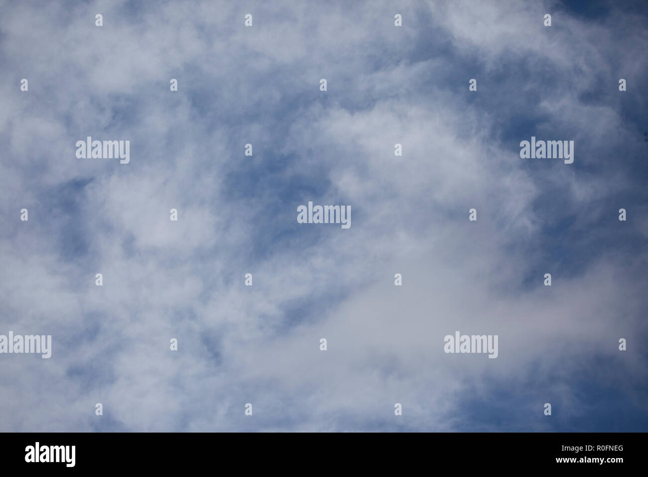 Bright blue sky with white fluffy clouds Stock Photo