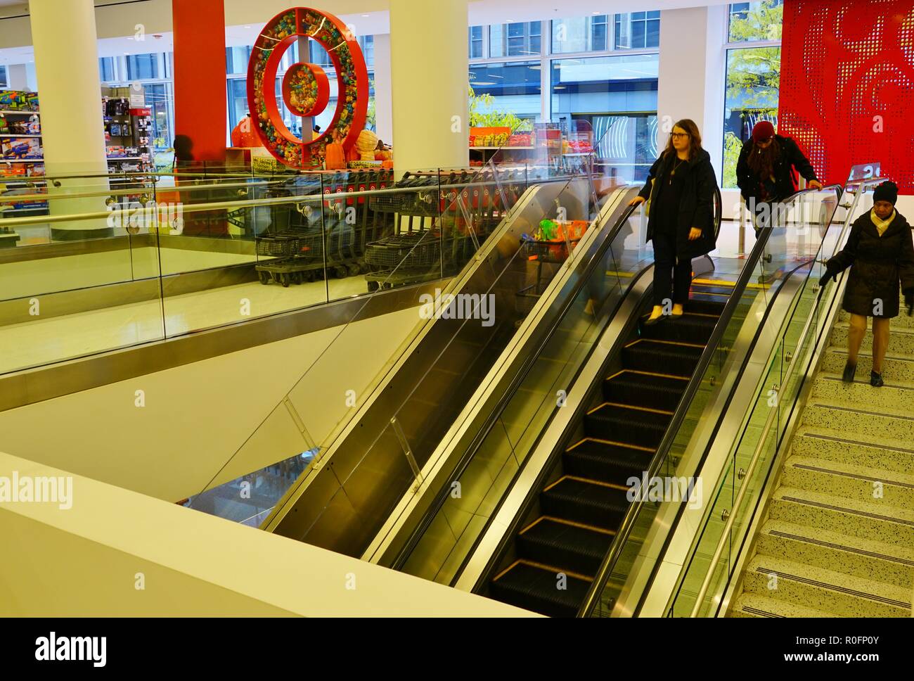 CHICAGO, IL -31 OCT 2018- View of a shopping cart conveyor escalator bringing carts up and down parallel to the customers in a two-story Target store. Stock Photo