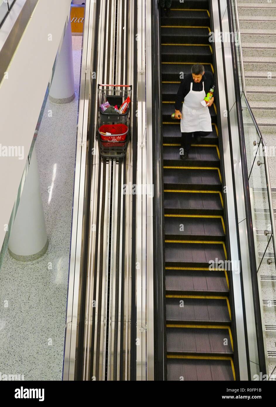 CHICAGO, IL -31 OCT 2018- View of a shopping cart conveyor escalator bringing carts up and down parallel to the customers in a two-story Target store. Stock Photo