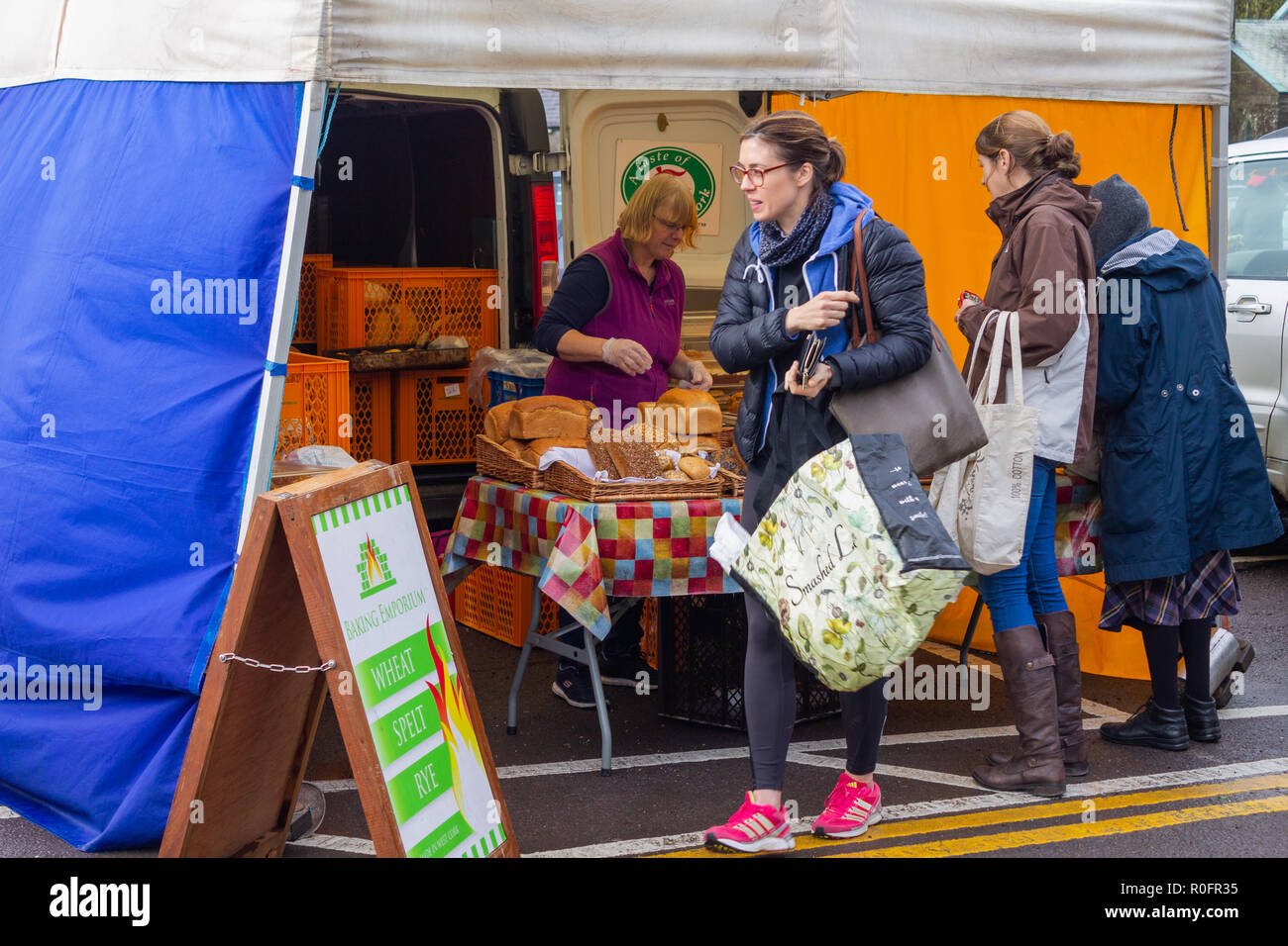 house wives shopping buying fresh bread at a country market stall skibbereen west cork ireland Stock Photo