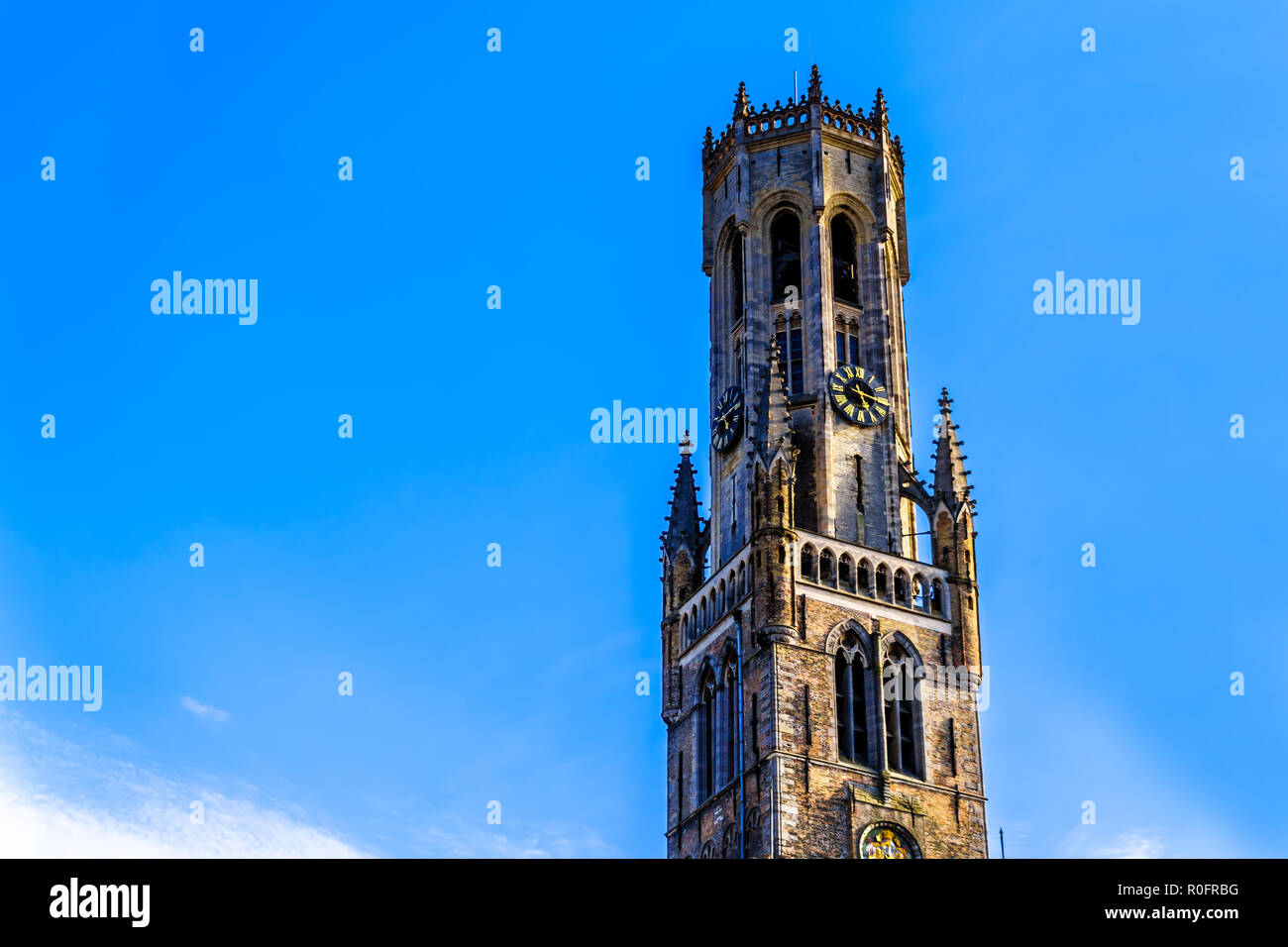 The Belfry (Belford) Tower against blue sky in the center of the