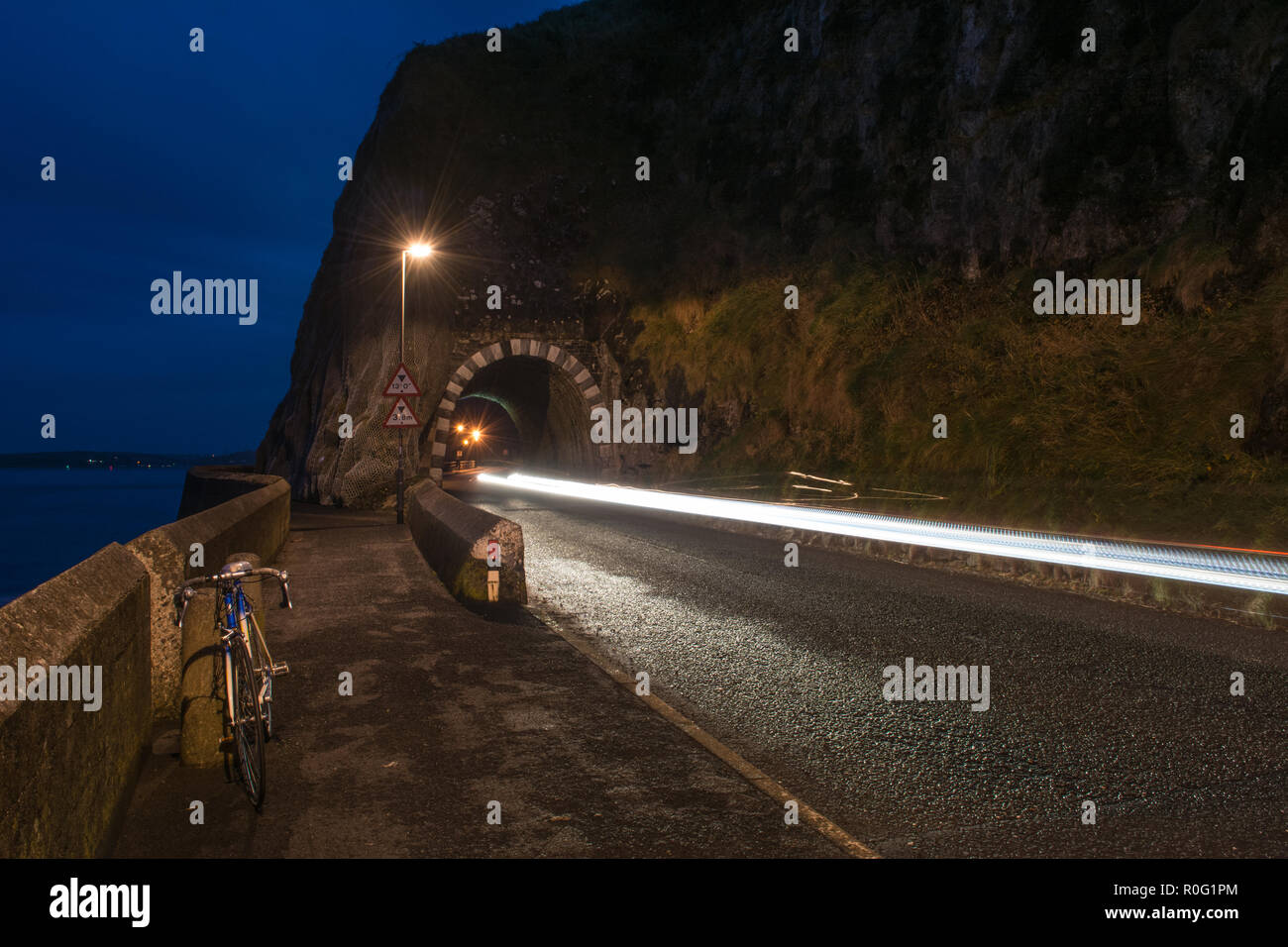 The Black Arch Larne County Antrim Northern Ireland  Night Shoot Light Trails Stock Photo
