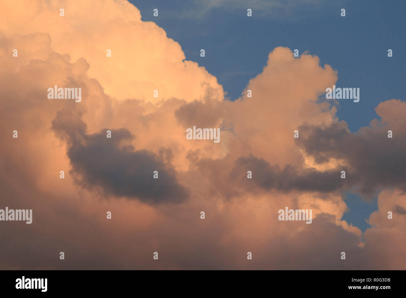 Evening summer clouds closeup. Captured by using zoom lens at golden hour sunset time. Stock Photo