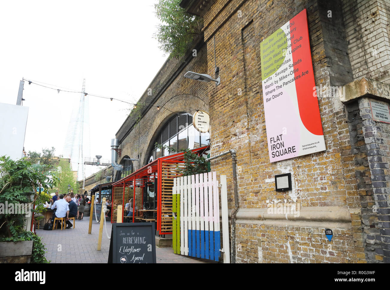 Flat Iron Square, a hub for street food, drinking and dancing in the shadow of the Shard, in Southwark, SE London, UK Stock Photo