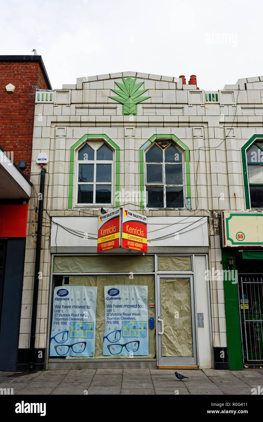 Two storey art deco building exterior with white ceramic tiled facade ...