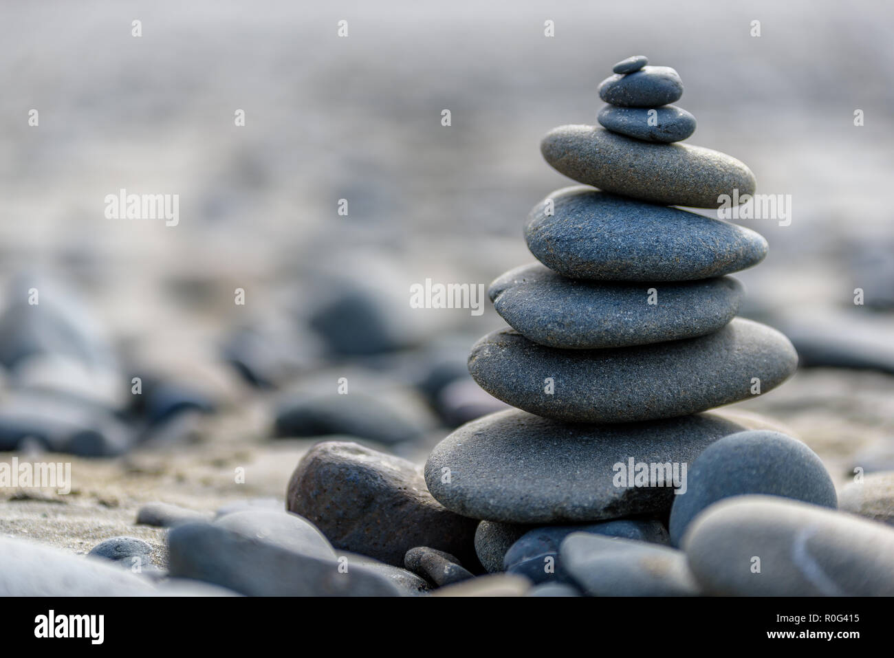 Balance And Wellness Concept Close Up Of Ocean Stones Balanced On Rocks And Ocean Driftwood Low Depth Of Field Zen And Spa Inspired Stock Photo Alamy