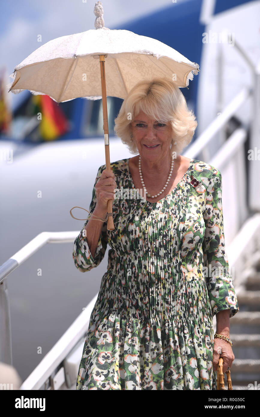 The Duchess of Cornwall shades herself from the sun as she arrives in Kumasi, on day five of her trip to west Africa with the Prince of Wales. Stock Photo