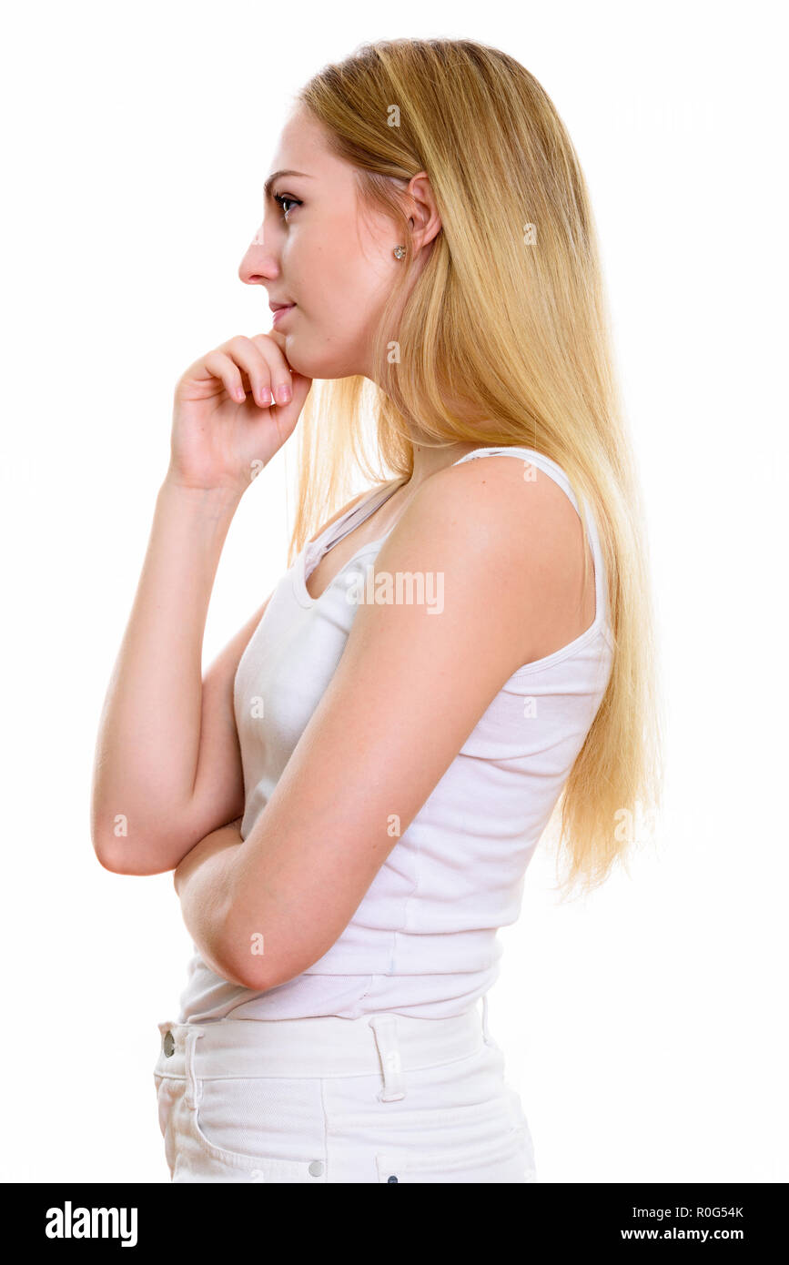 silhouette of a beautiful girl at sunset in a field, face profile of young  woman on nature Stock Photo