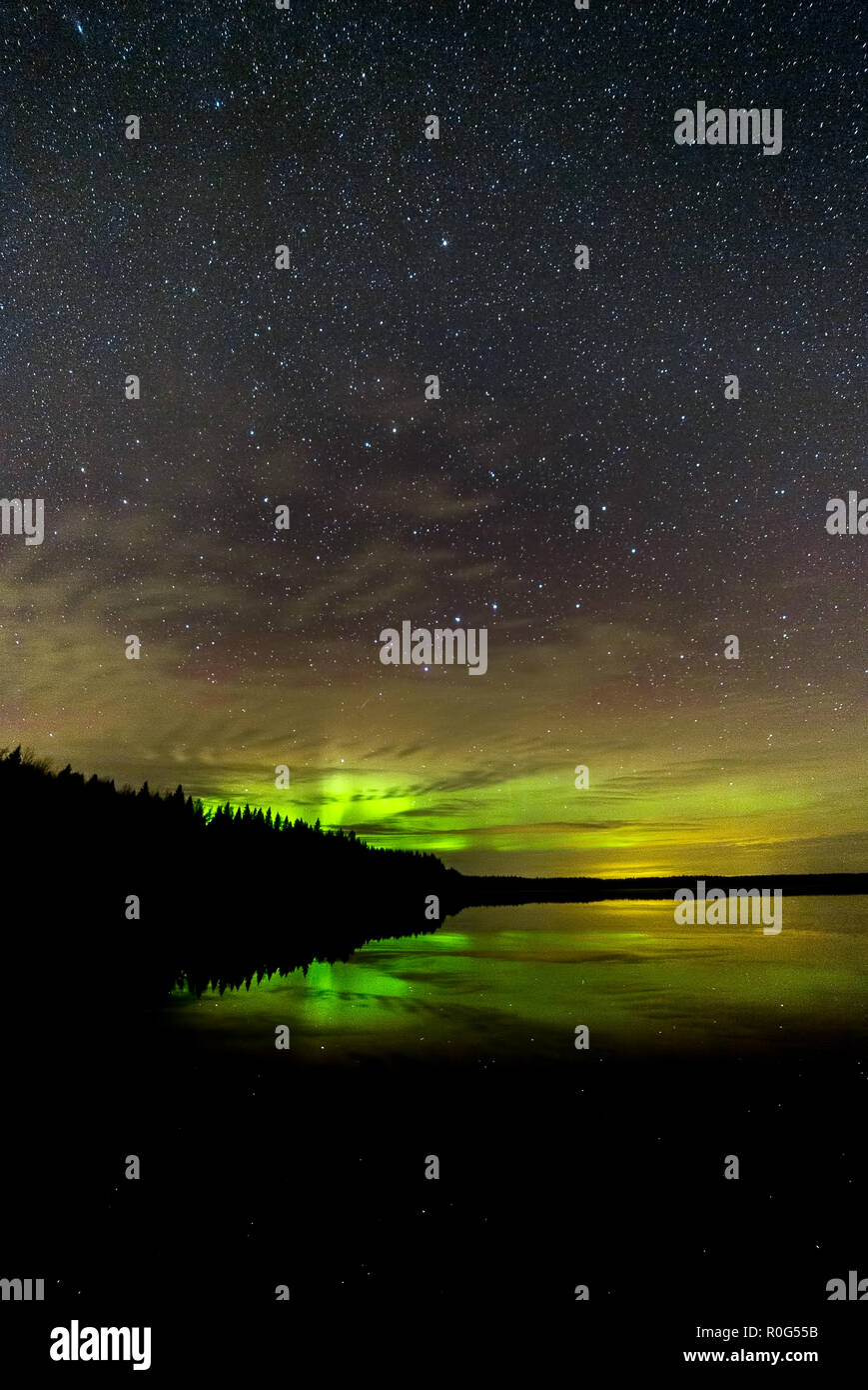 Northern Lights over Lake with clouds and stars Stock Photo - Alamy