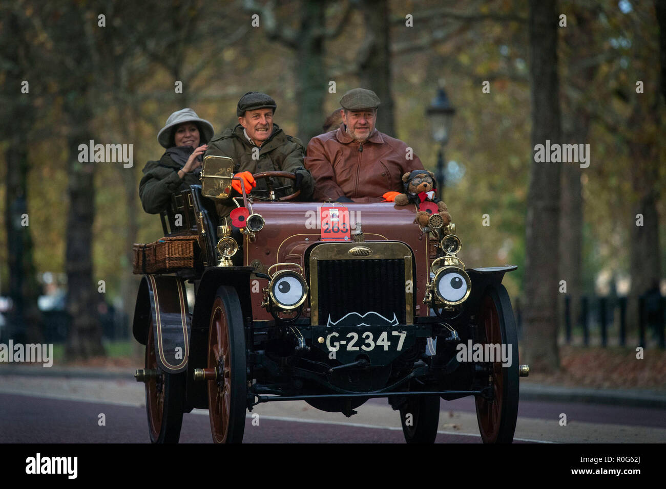 Participants drive along Birdcage Walk, London, during the annual Bonhams London to Brighton Veteran Car Run. Stock Photo