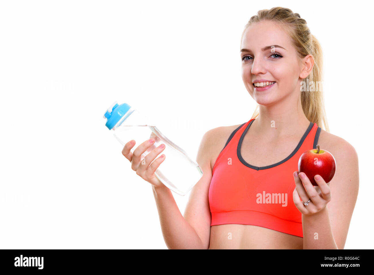 https://c8.alamy.com/comp/R0G64C/young-happy-teenage-girl-smiling-while-holding-water-bottle-and-R0G64C.jpg