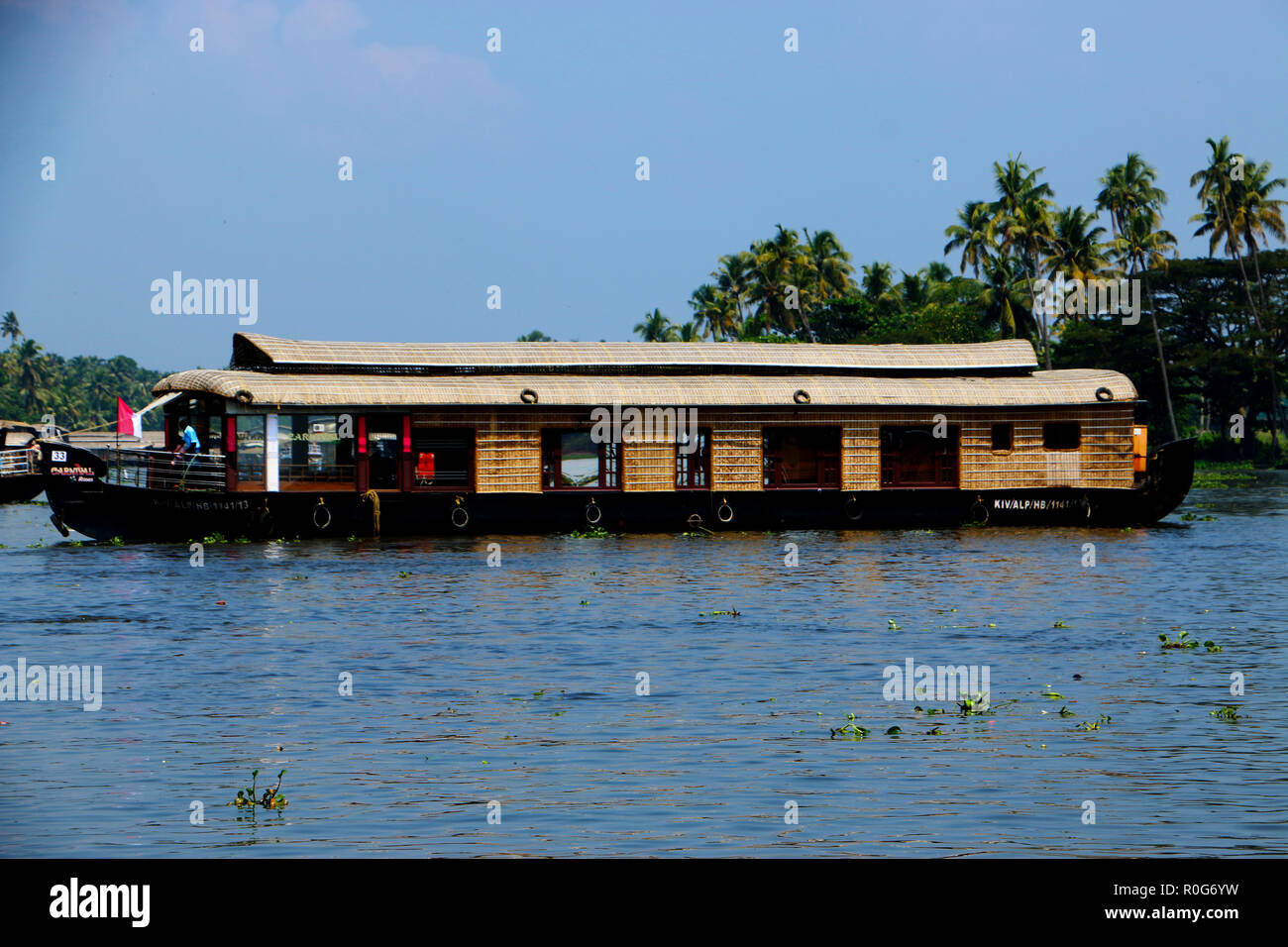 Beautiful alleppey house boats wading through backwaters of Kerala Stock Photo