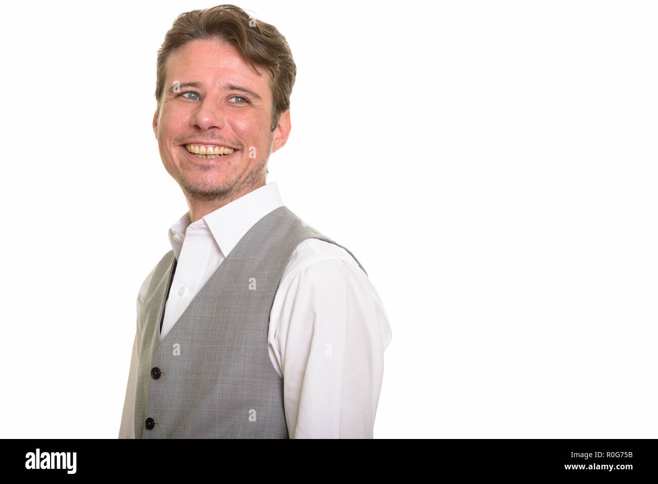 Happy formal Caucasian man smiling wearing vest Stock Photo Alamy