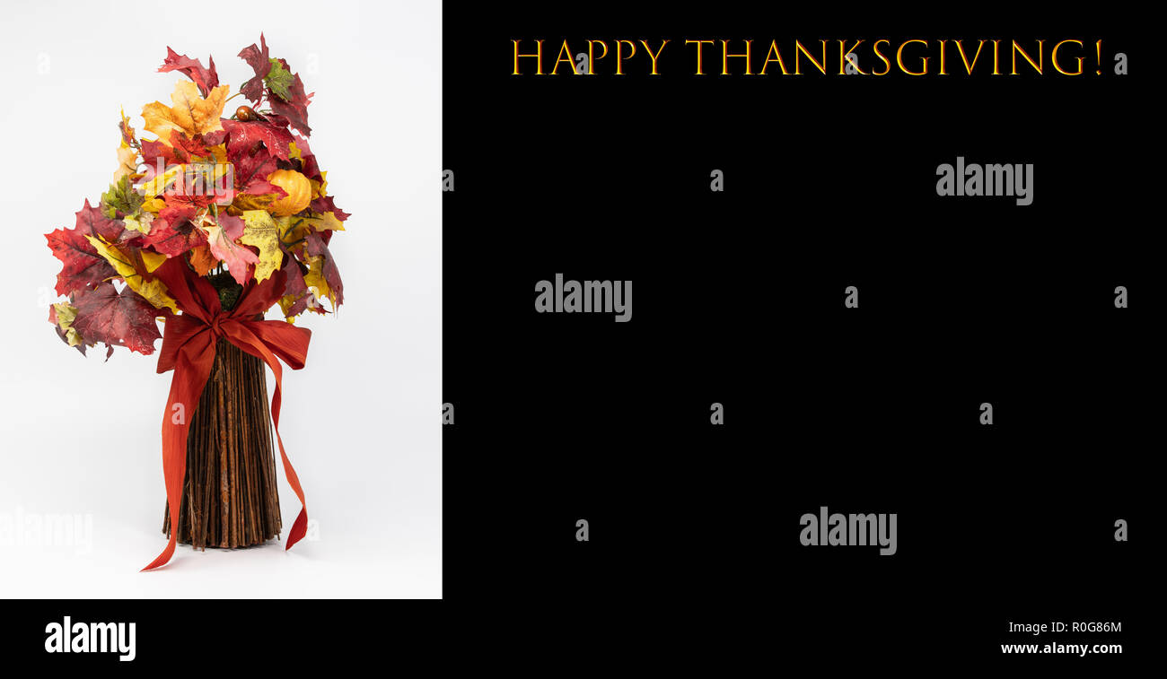 Happy Thanksgiving card with a bouquet made out of leaves and sticks, tied by a red bow. Stock Photo