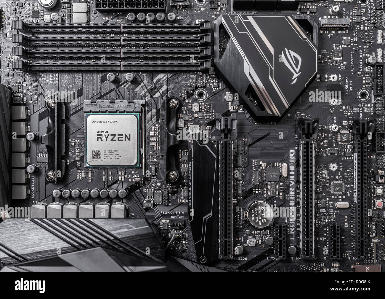 Processor Ryzen 7 2700X against the background of a computer motherboard  Asus rog crosshair vii hero Stock Photo - Alamy