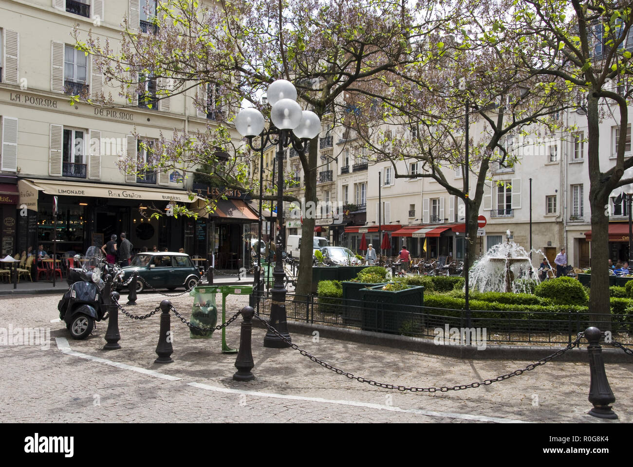 A fountain stands in the center of Place de la Contrescarpe, a square ...