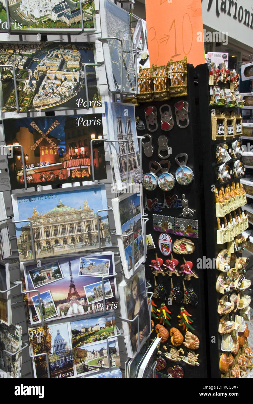 Souvenir postcards, bottle openers, for sale at a shop on Rue Mouffetard, a popular
