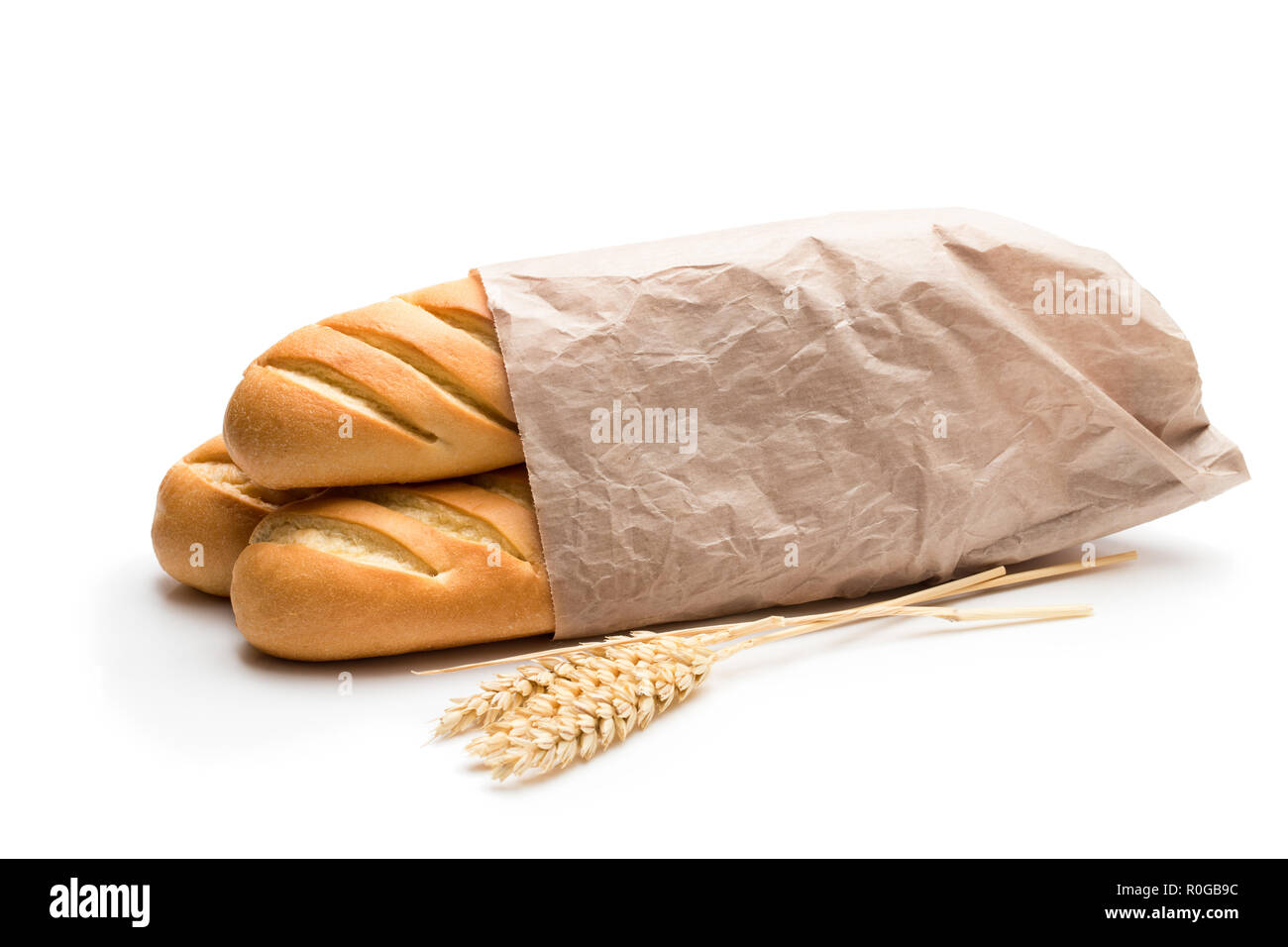 Delicious baguettes in paper bag isolated on white Stock Photo - Alamy