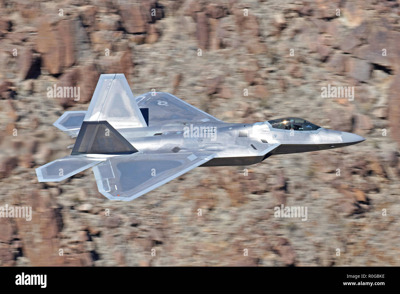 Lockheed F-22A Raptor flown by US Air Force flown by the F22 Demonstration Team 'Raptor 11' transiting Death Valley during 2018 Stock Photo