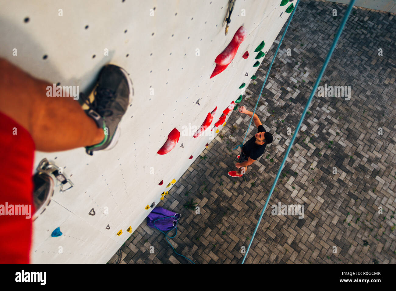 Acrobat man prepare for bouldering on big wall outdoors Stock Photo Alamy