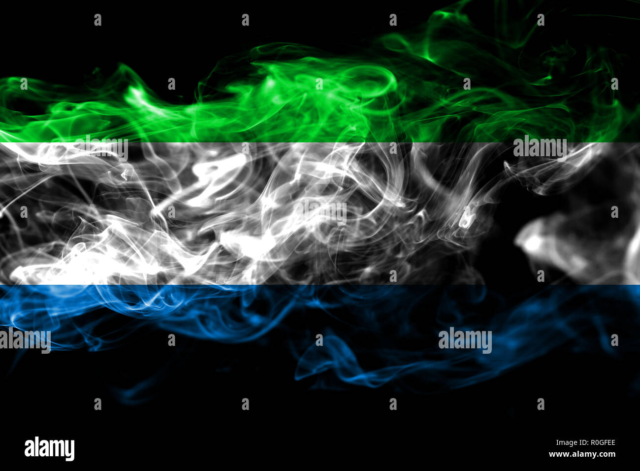 National flag of Sierra Leone made from colored smoke isolated on black ...