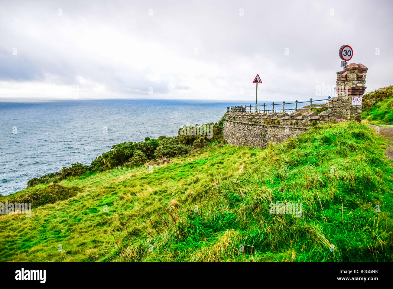 Beautiful landscape with green hill and blue sea in the Isle of Man ...