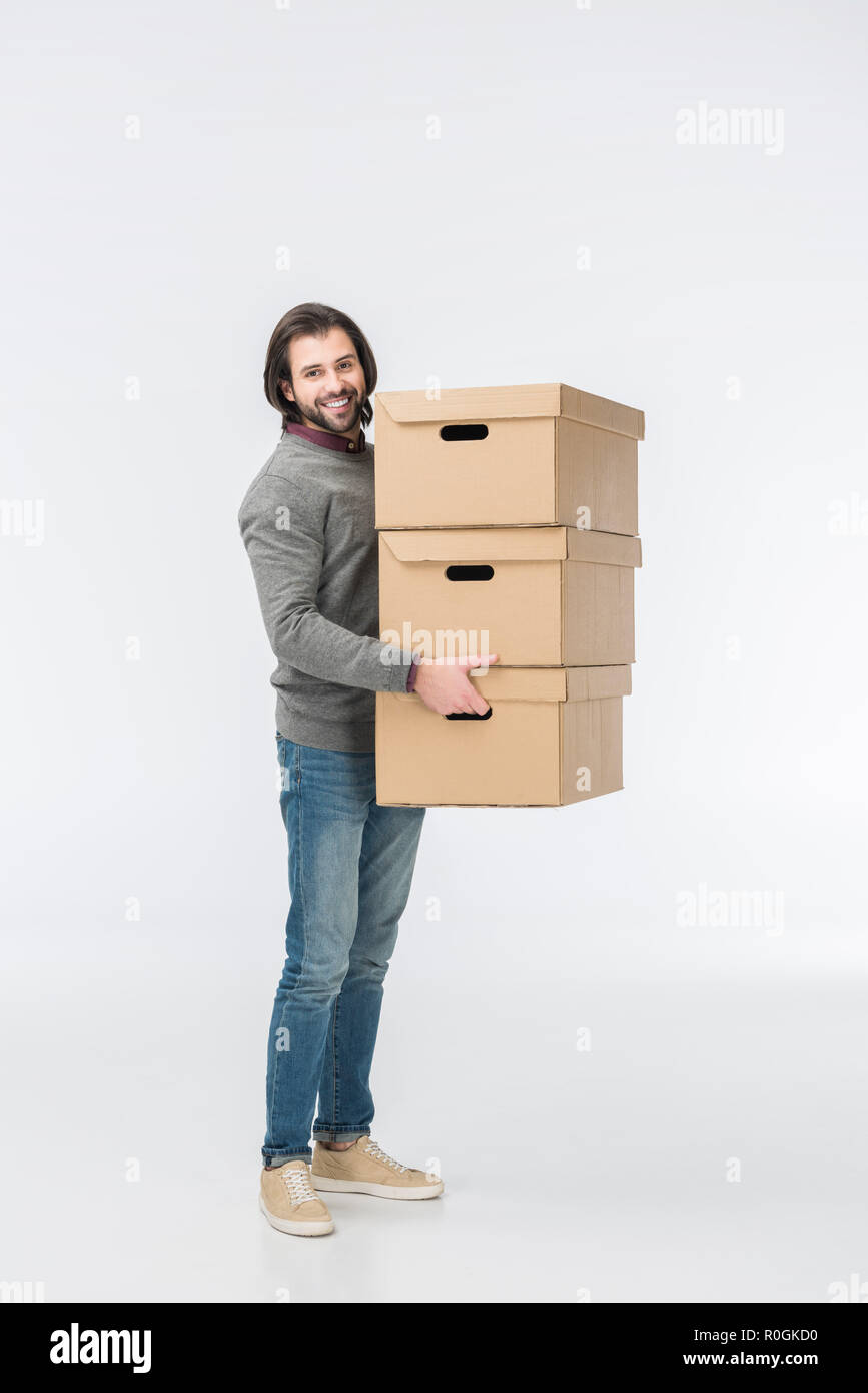 man holding stack of cardboard boxes isolated on white Stock Photo