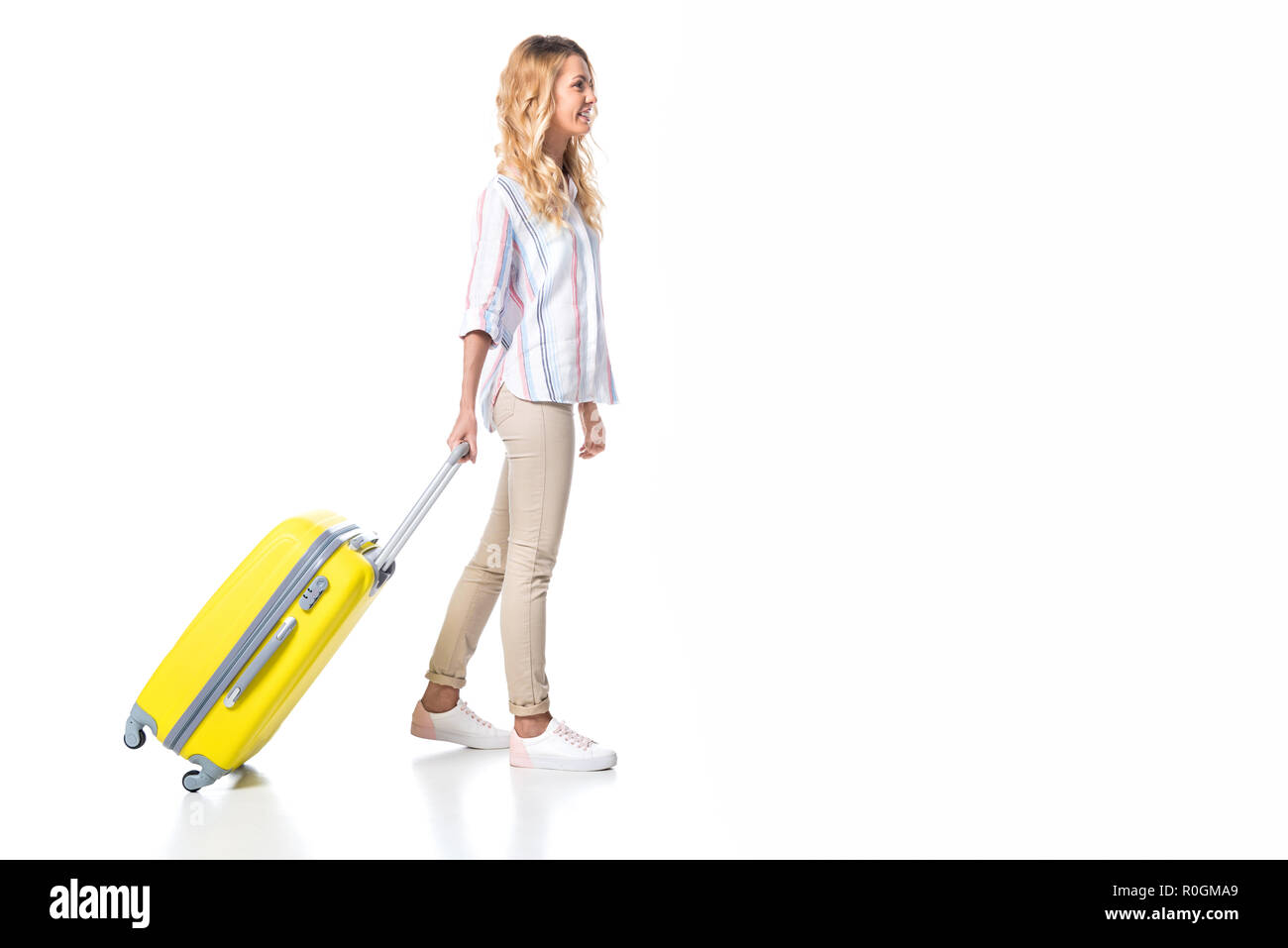 woman with yellow travel bag isolated on white Stock Photo Alamy