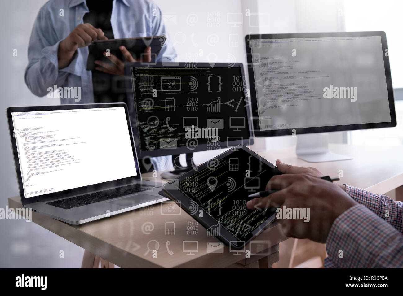 man work Coding software developer programmer is coding on a desktop computer Stock Photo