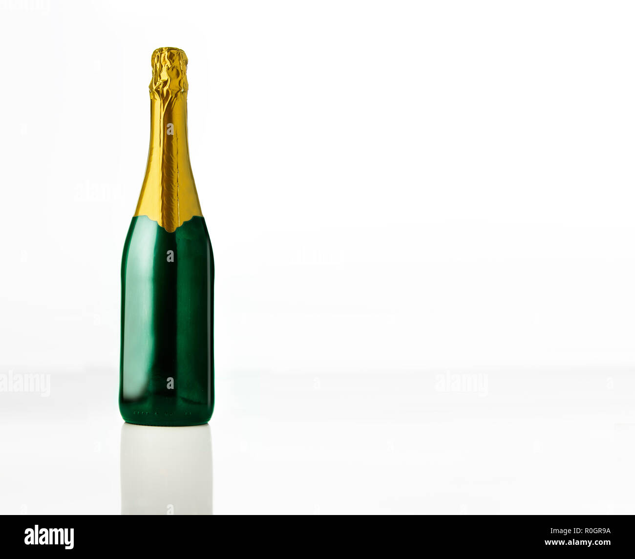 Champagne bottle isolated over white background Stock Photo - Alamy