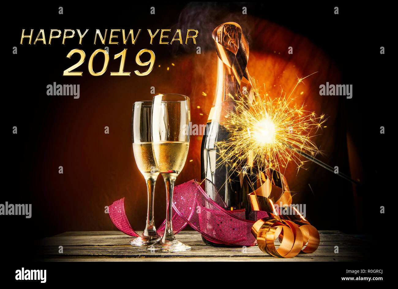 Two champagne and bottle with fireworks for new celebration. Happy New Year 2019 Stock Photo